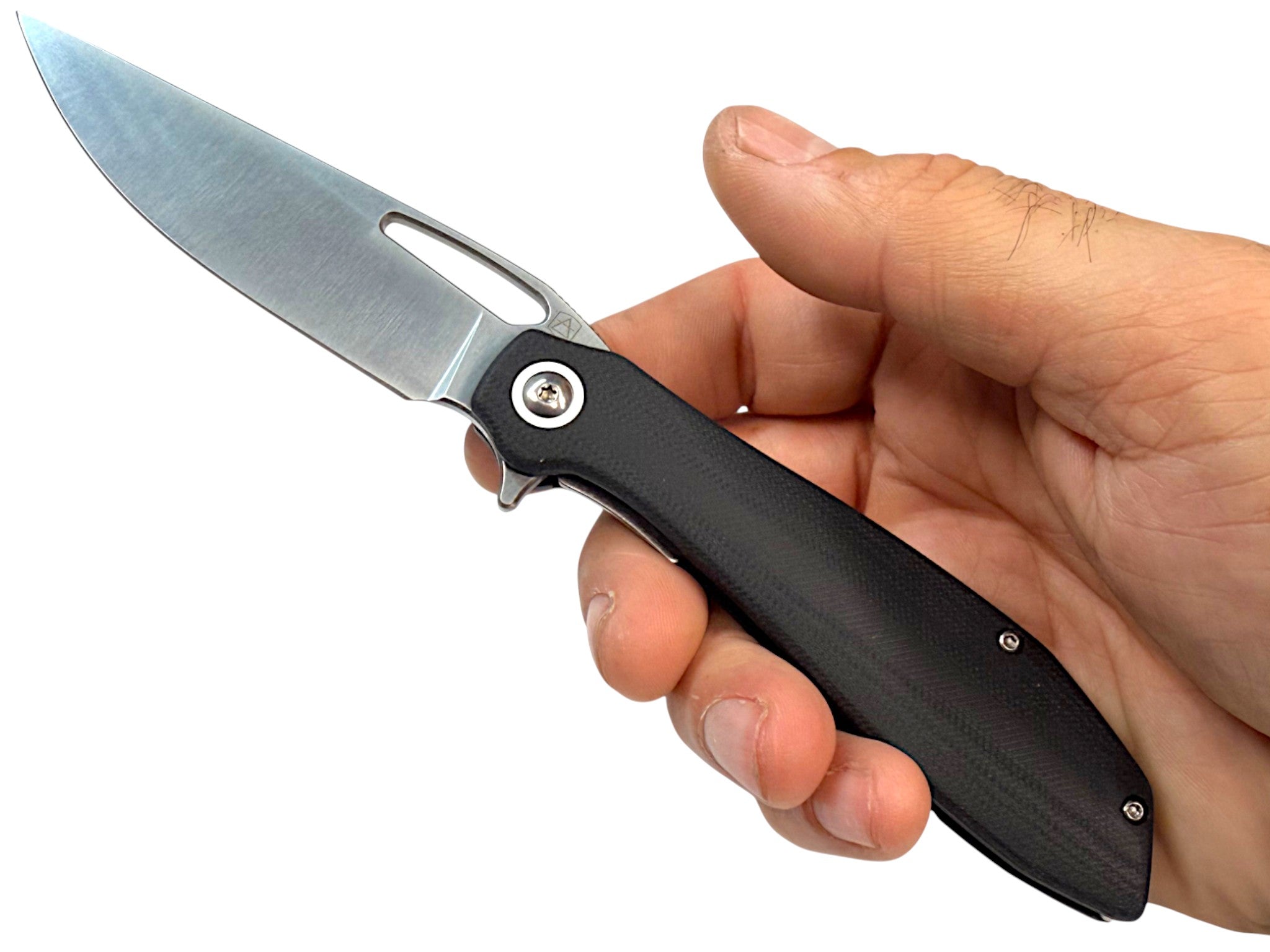 CountyComm BXTR folding knife with a semi-polished 8Cr13MoV steel blade and black G10 handle, held in hand.