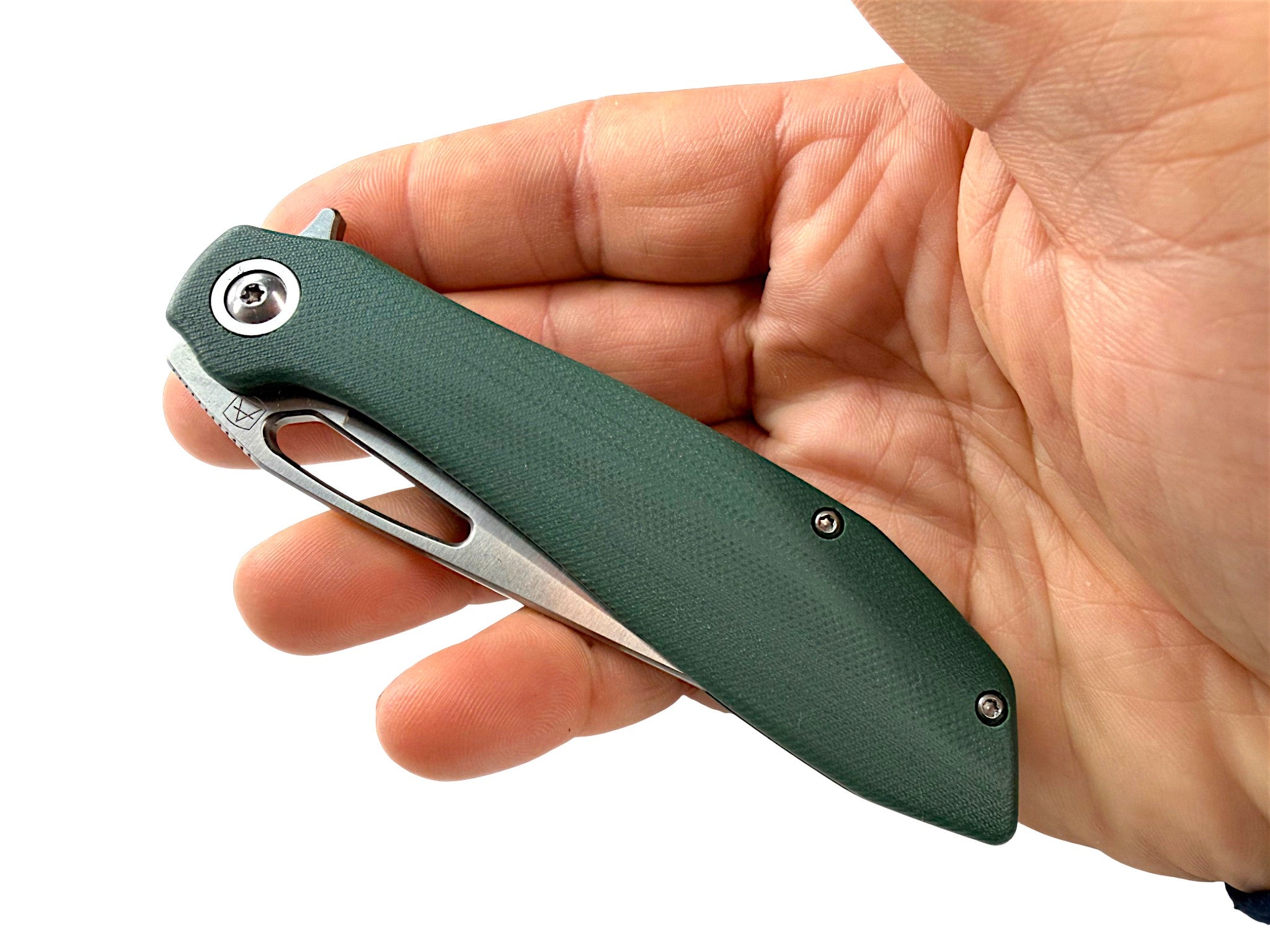 CountyComm green G10 handle folding knife with semi-polished 8Cr13MoV steel blade, held in hand.